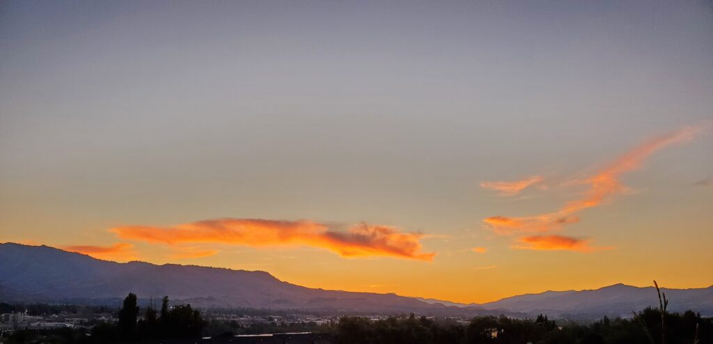 Summer sunset over city.